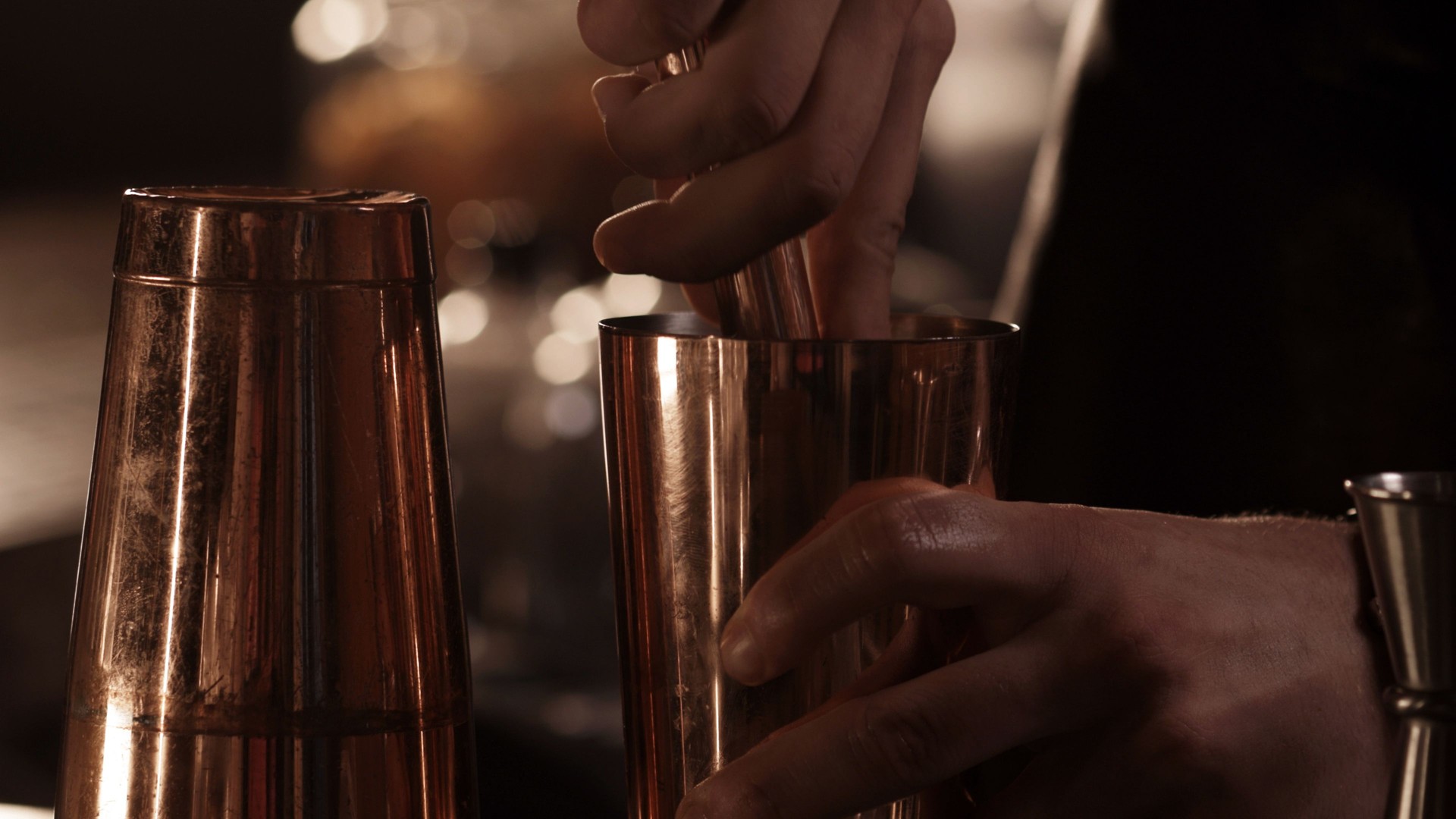 Bartender Pouring Cocktail from Shaker into Glass – Preparing Alcoholic or Non-Alcoholic Drinks at the Bar