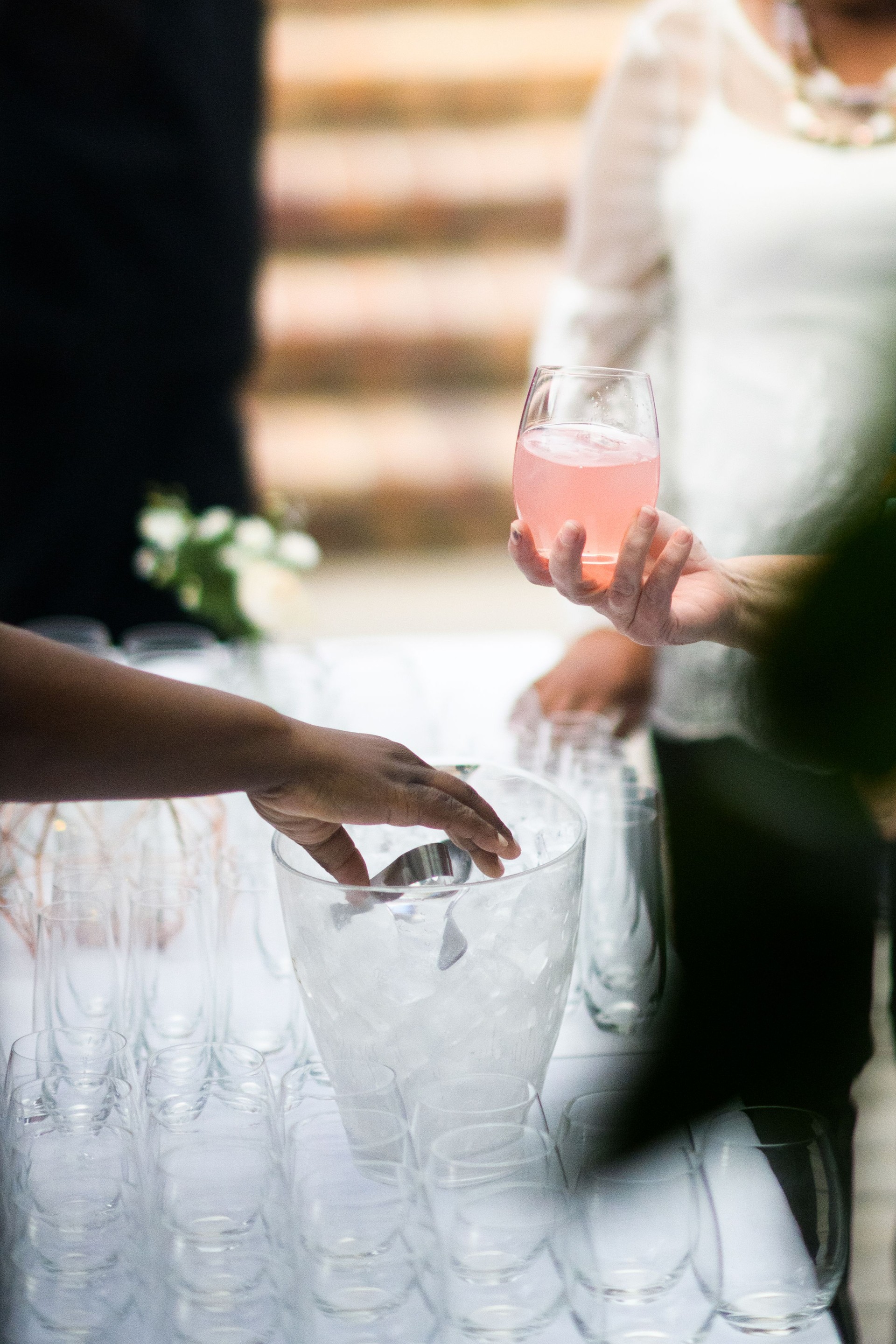 Close-up of a social gathering with gin drinks and glasses on a table